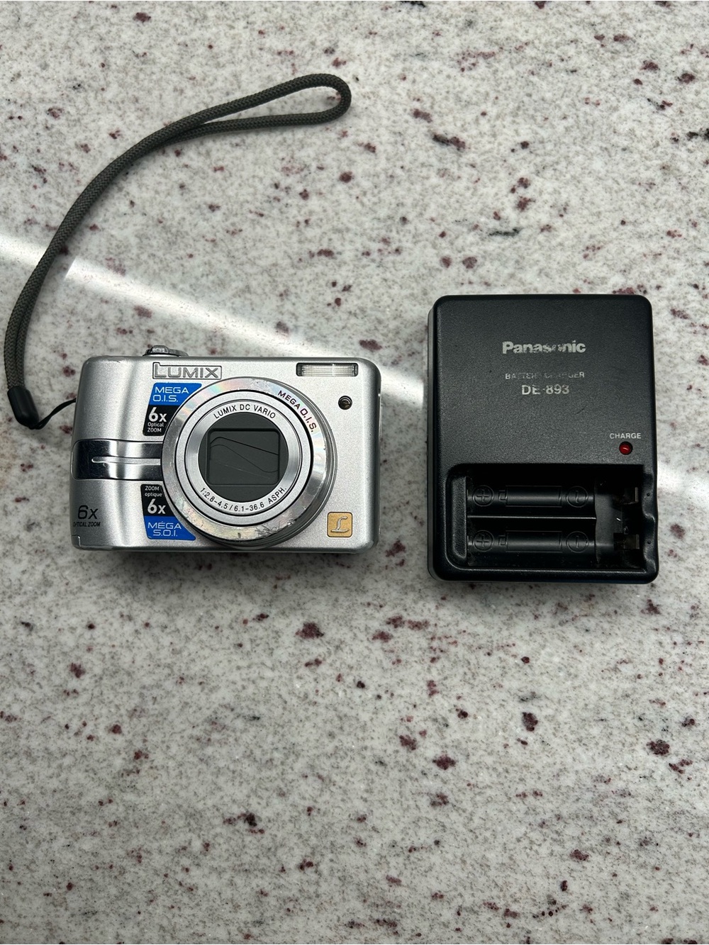 Panasonic Lumix Silver Compact Digital Camera with Black Charger